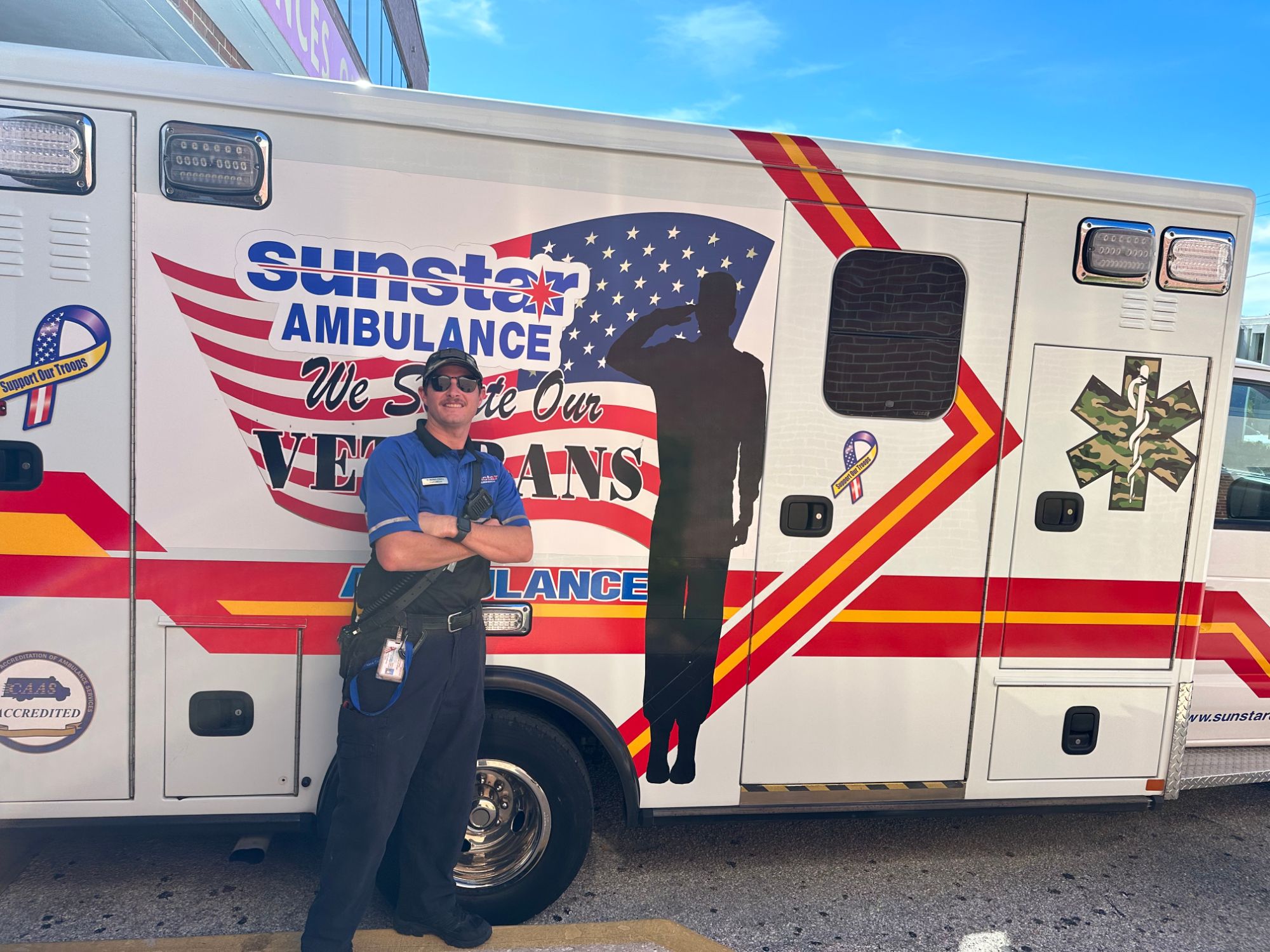 Cody Bonalewicz in front of an ambulance honoring veterans